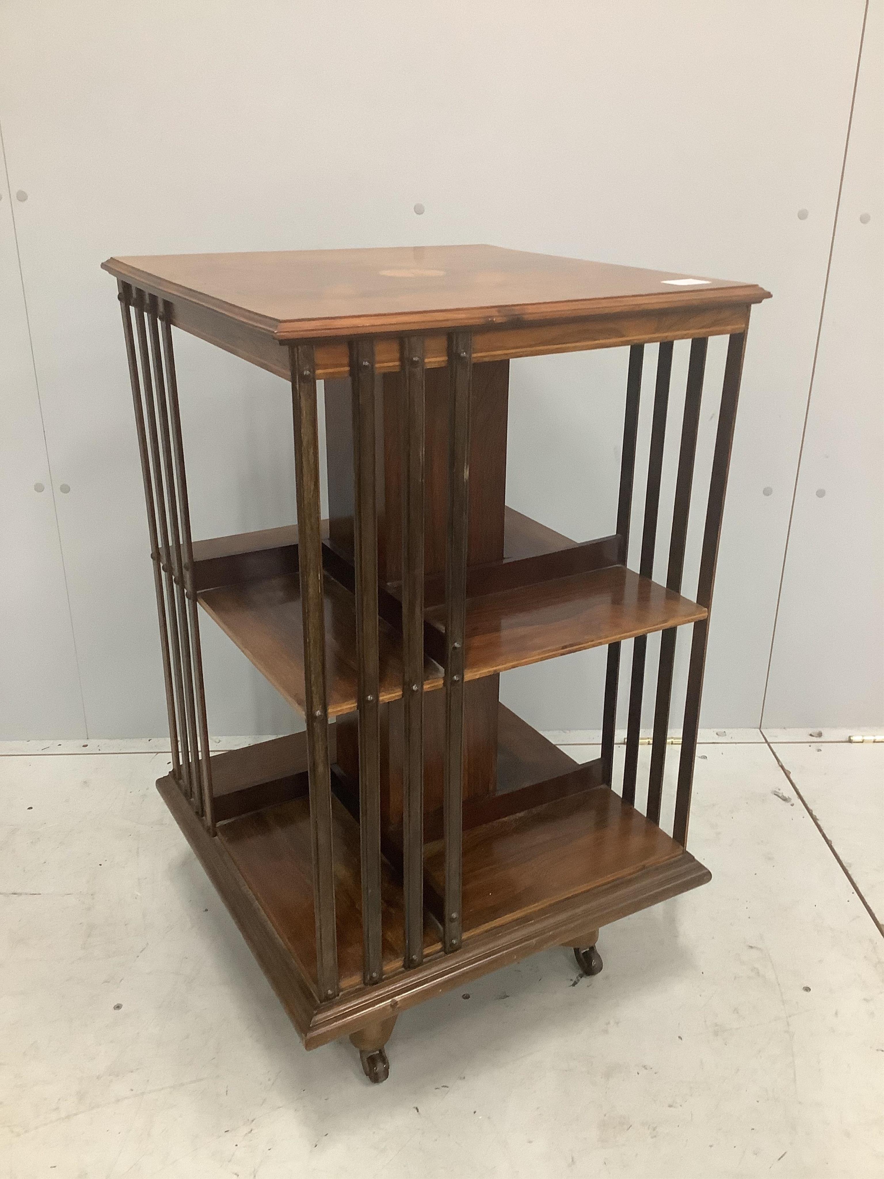 An Edwardian inlaid rosewood revolving bookcase, width 52cm, depth 52cm, height 87cm. Condition - good